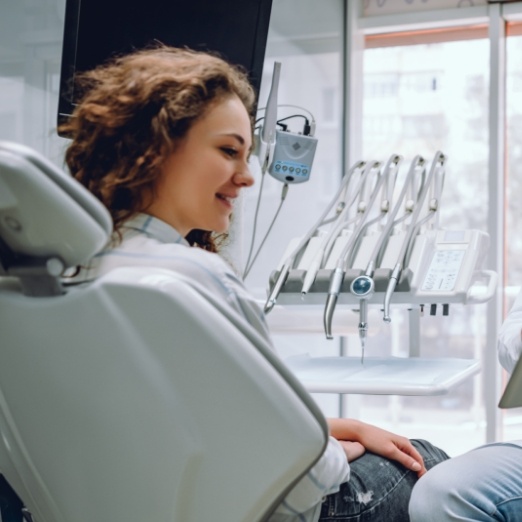 Woman talking to dentist in state of the art dental office