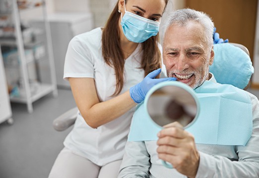 patient smiling after getting dental implants in Glenmont