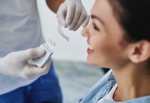 Dentist talking to patient about ClearCorrect aligner tray orthodontics