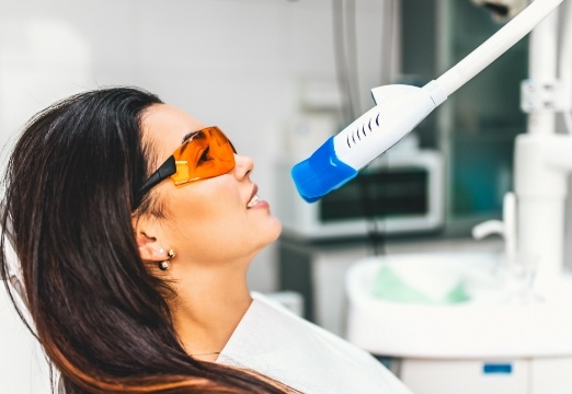 Woman receiving teeth whitening